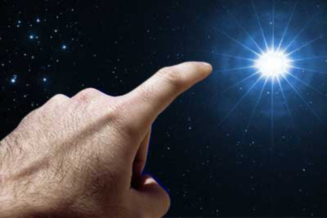 Picture of a hand pointing at an exceptionally bright star